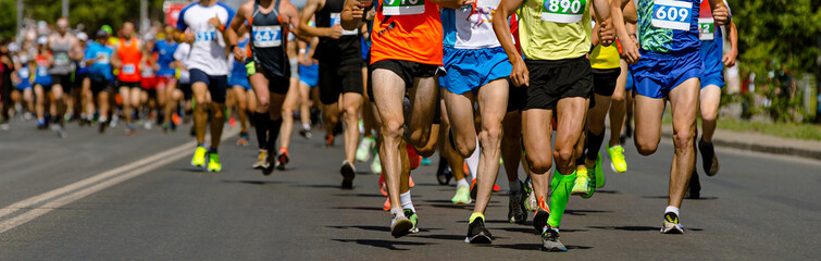 leading group runners athletes running city marathon, male joggers participants race street of city, athletics competition