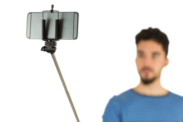 Casual man using a selfie stick