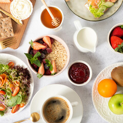 Healthy breakfast set on grey background. The concept of delicious and healthy food. Top view, copy space.