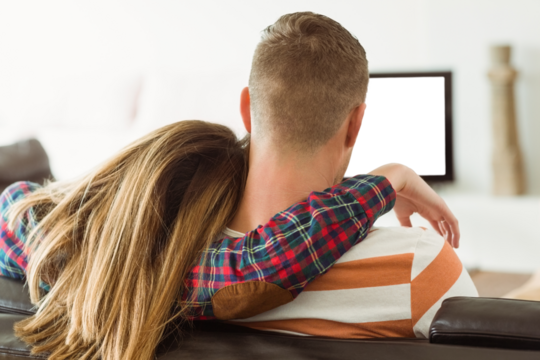 Cute couple relaxing on couch