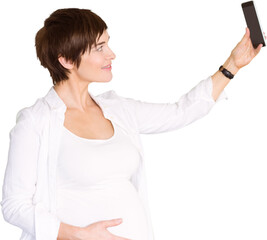Happy pregnant woman taking selfie through smart phone