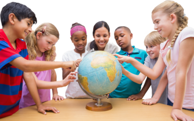 Cute pupils and teacher looking at globe in library 