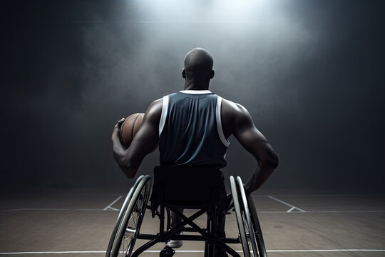 Generative AI illustration of unrecognizable handicapped male player in wheelchair on sports ground with basketball while training in bright gym with dark background