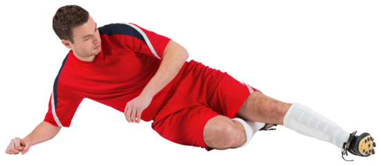 Football player in red kicking