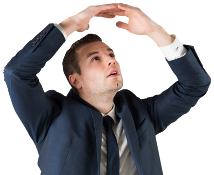 Businessman standing with hands over head