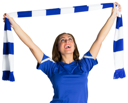 Pretty football fan waving scarf