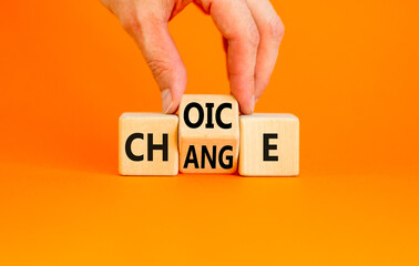 Choice and change symbol. Concept word Choice Change on wooden cubes. Businessman hand. Beautiful...