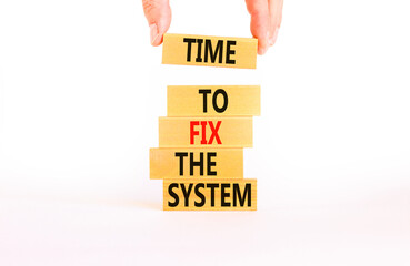 Time to fix the system symbol. Concept words Time to fix the system on wooden block. Beautiful white table white background. Businessman hand. Business and time to fix the system concept. Copy space.