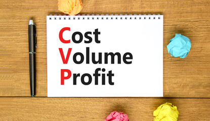 CVP cost volume profit symbol. Concept words CVP cost volume profit on white note on beautiful wooden table wooden background. Pen. Business and CVP cost volume profit concept. Copy space.