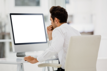 Rear view of businessman looking at computer monitor