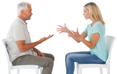 Unhappy couple sitting on chairs having an argument