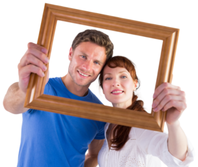 Couple holding frame ahead of them