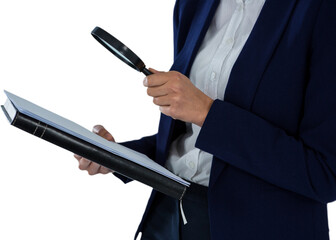 Businesswoman looking at document through magnifying glass