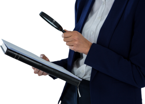 Businesswoman looking at document through magnifying glass