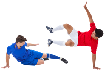 Football players tackling for the ball