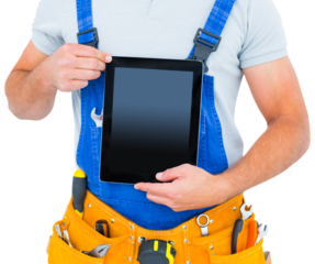 Midsection of repairman holding digital tablet