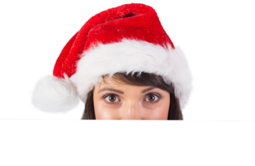 Close up portrait of pretty woman in santa hat