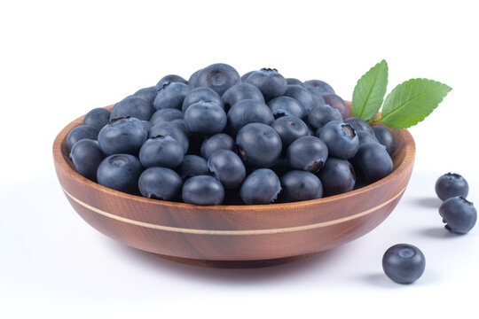 Closeup of fresh juicy blueberries on a wooden plate isolated on white background, copy space. High resolution. Generative AI