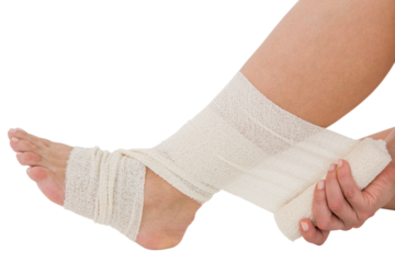 Sitting woman banding her ankle
