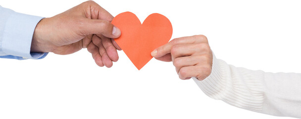 Couple holding paper heart shape paper