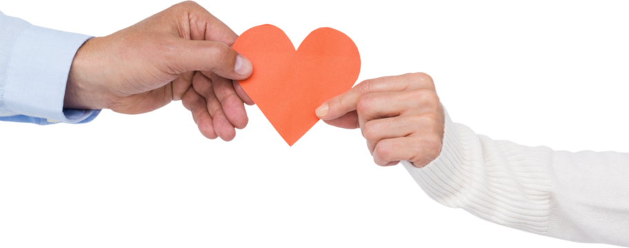Couple holding paper heart shape paper