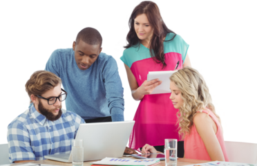 Man discussing with coworkers at desk 