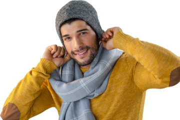 Smiling man posing against black background