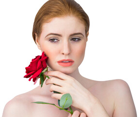Obraz premium Beautiful redhead posing with red rose