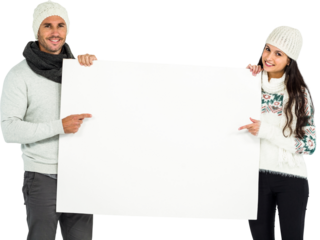 Portrait of smiling couple holding white placard