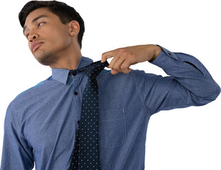Businessman loosening necktie