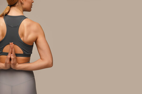 Banner of fitness young woman doing yoga stretching exercises on mat yoga fitness exercises in an orange bodysuit. Healthy lifestyle Calmness and relax at yoga studio.