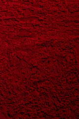 Red texture. Powder background. Pedra, sand. Red color. Dark red. Intense dark red. Cracks, waves, lines, circles, depressions. convex. Banner, advertising, for inscription