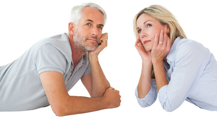 Thoughtful couple lying on floor