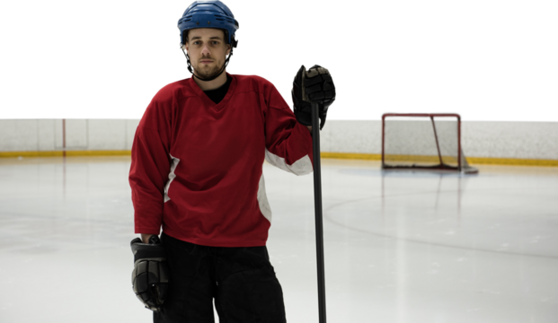 Portrait of ice hockey player at rink - Powered by Adobe
