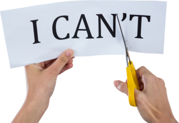 Conceptual image of businesswoman cutting paper that reads we cant