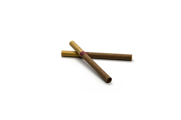 Two brown cigarettes on a white background