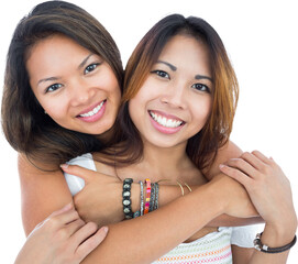 Two pretty sisters posing in front of the camera