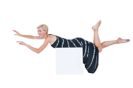 Attractive woman lying on front over block