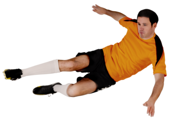 Football player in orange kicking