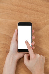 Hands touching smart phone