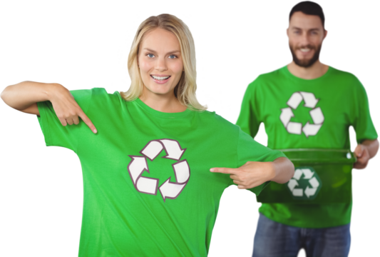Portrait of woman pointing towards recycling symbol on tshirts 