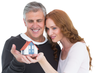Casual couple holding small house