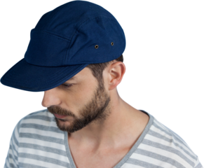 Thoughtful young man looking down over white background