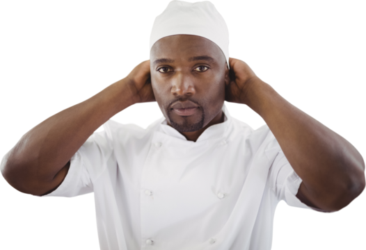 Portrait of chef adjusting hat