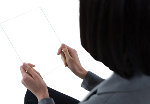 Female executive using a glass digital tablet