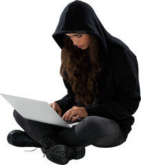 Serious female hacker using laptop while sitting 