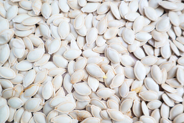 Pumpkin seeds background on craft paper surface
