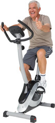 Senior man gesturing thumbs up on stationary bike