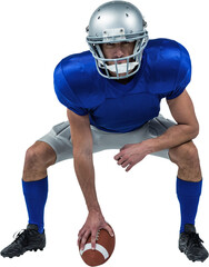 Obraz premium Full length of American football player placing ball