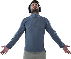 Man with arms outstretched while listening music